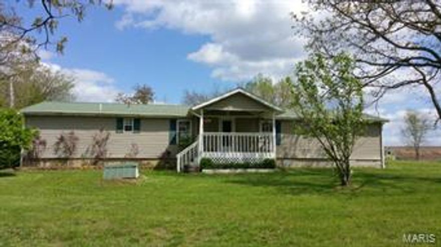 Beautiful 3 bedroom 2 bath home is all updated and ready for you. The large living room has a pellet stove for those cold winter days and walks out to the patio. There is a large kitchen with lots of cabinets and under cabinet lighting which makes canning from the garden or jelly from all the fruit trees and strawberry patch on the almost 5 acres so much easier. There is formal dining area for entertaining. The big master bedroom suite has his and her closets and an impressive master bath. For the shop person the oversized garage has 2 separate 220 outlets. Have the kids collect the eggs from the chicken coop or just let them play in the tree house. A country setting but only about 1 mile to town.