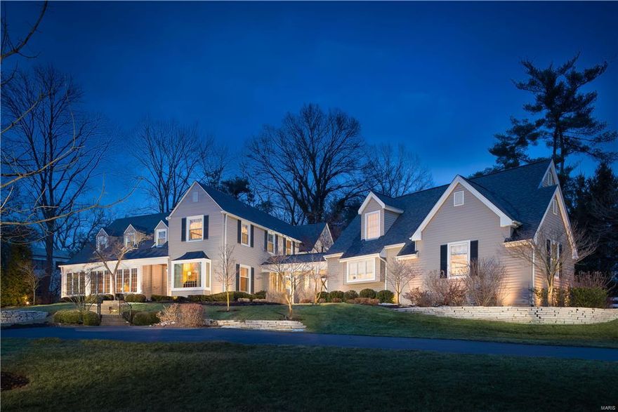 On a premier lane, a circle drive leads to charming 2-story New England style home that has been renovated while still maintaining its character. The graceful entry leads to the dining room and living room with fireplace, built-in bookcases, bay with window seat and French doors that step down to the enclosed sunroom with bead board ceiling and tile floor.  The inviting eat-in kitchen with top-of-the-line appliances, white cabinets and granite and walnut countertops open to the sun-filled hearth room and game room with French doors to the terraces and outdoor fireplace. The luminous landing at the top of the stairs leads to a private master suite with fireplace, large bath and awesome closet. There are 4 additional bedrooms and 3 updated baths. Graceful appointments throughout, hardwood floors, main floor laundry, walk-in pantry, and a heated 3 car garage with 2nd floor that could be converted to living space, professional landscaping and outdoor lighting complete this enchanting home. Additional Rooms: Sun Room