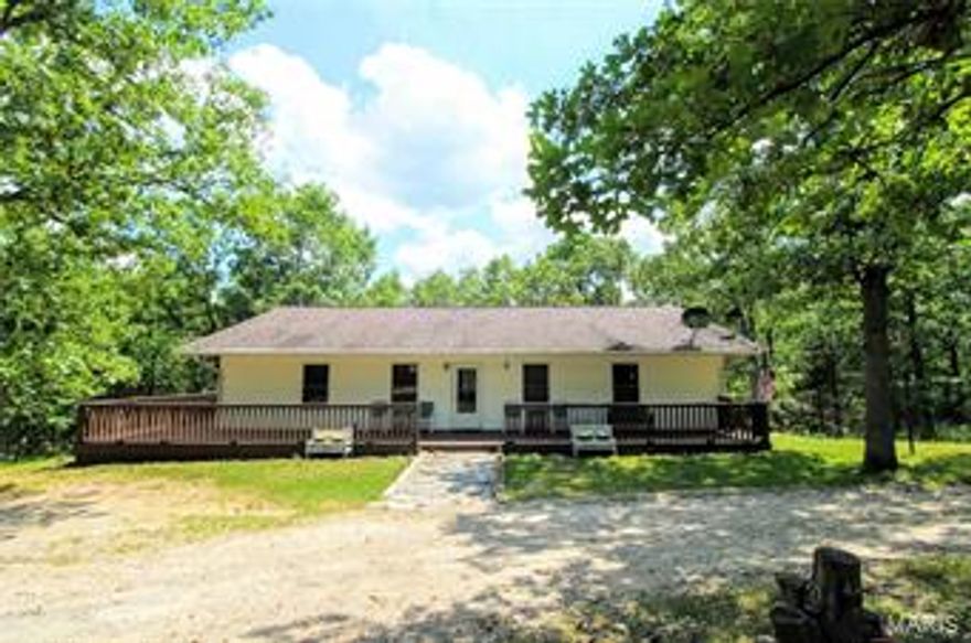 Are you looking for a CUSTOM home with a ton of land? This 4 bed, 2 bath home sits on approx. 55 ACRES! The entry foyer looks the living room downstairs and the floor to ceiling windows. There is Bamboo flooring through out most of the home. The upstairs offers a large master bedroom that is carpeted, a master bath and 2 guest rooms. The main level has an open floor plan and a great room with a ton of natural lighting, an AMAZING kitchen with some updated appliances (refrigerator does not convey), custom cabinetry, a center island, plenty of counter top space and a WALK IN PANTRY, the laundry room, an office/den area and an additional guest bedroom. Sit back and relax after a long day on the HUGE front deck! The detached shop has 2 bays, a wood burning furnace, 220 power outlets, a bathroom with a toilet and large sink and a storage room. There is a space set up for a mobile home, or to build a home or add a bigger shop that has septic, water and electric. SELLERS ARE HIGHLY MOTIVATED!