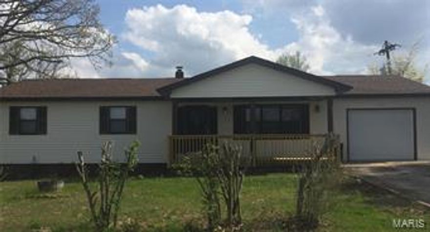 Excellent location in this beautifully remodeled home!  Brand new carpet and laminate flooring throughout the main floor, good sized bedrooms and new decking in front and back.  The adorable kitchen has a brand new stainless steel electric range and refrigerator,  new laminate flooring, and attractive tile back splash. This house features two, newly remodeled bathrooms on the main level and a half bath in the unfinished basement. Conveniently located to both St. Robert and Waynesville.   This home is a must see!!