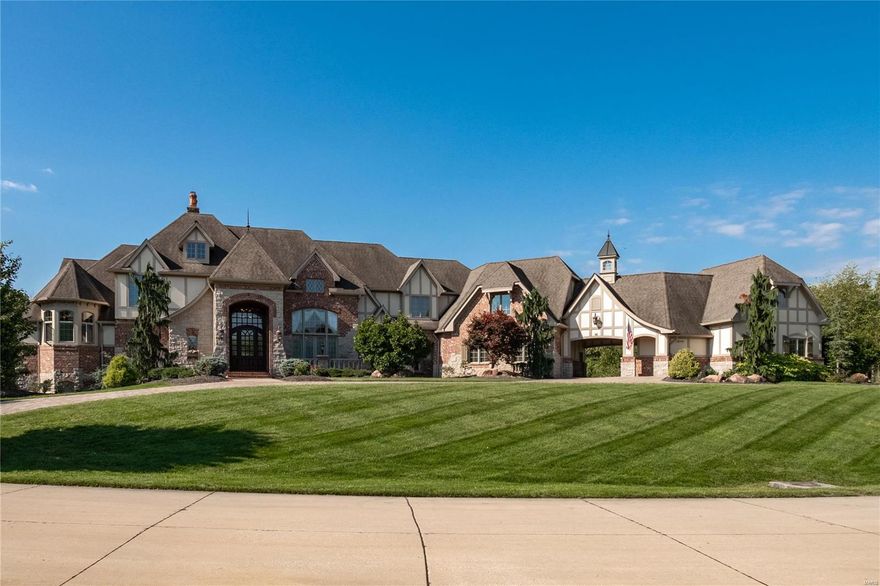 An impressive sense of arrival greets you at the gated entry, leads to a paved driveway and into the columned two-story foyer with marble flooring. Inspiring views of the majestic grounds are framed by the great room's expansive windows, exquisite millwork and 25 foot ceilings. Timeless and sophisticated appointments are accented by exotic wood flooring throughout.  A delightful kitchen offers a butler’s pantry, large island, state-of-the-art appliances and a windowed breakfast room, all of which connect with a warm hearth room and the tranquil outdoors. An elegant main floor primary suite features a paneled library, spa bathroom and French doors which open to the patios and pool.  Luxury amenities include an abundant in-law suite, elevator, game rooms, media room, wet bar, an oversized 5-bay garage with room for 6 cars, motor court, stone fountain, Koi pond, saltwater pool, pool house, stone patios, fire pit and curated landscape w/ mature plantings...all resting on 3 secluded acres!