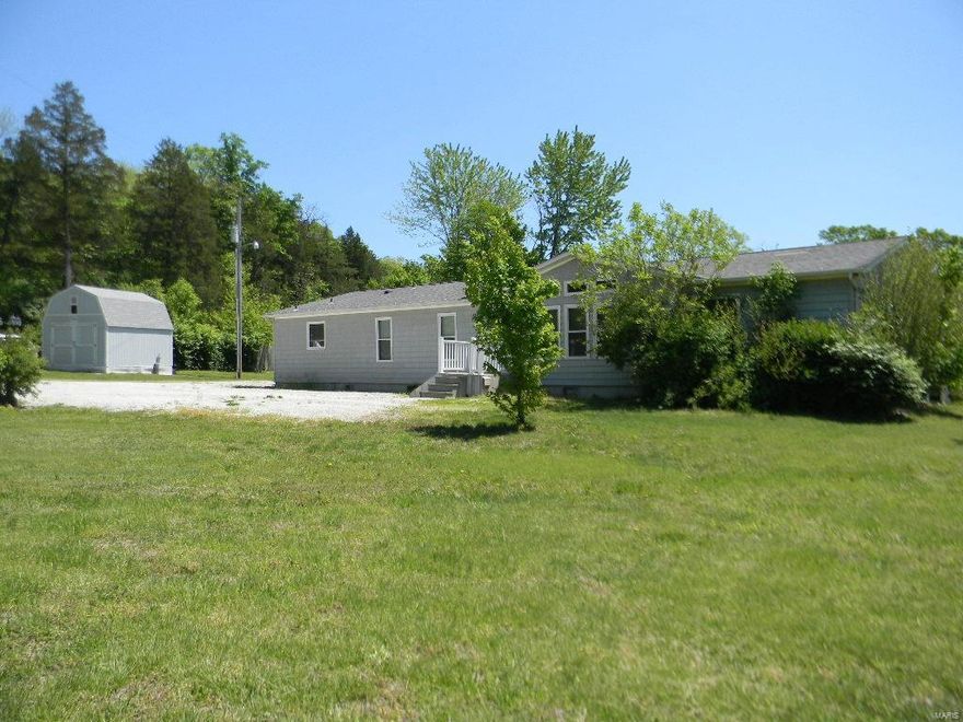 SPACIOUS! You'll love the open floor plan w/plenty of room inside PLUS room to roam outside! Lots of windows to view the gorgeous country setting from this home situated on 6.75 acres w/2 large ponds & several smaller ones-lots of fishing fun! An open living & dining room gives you the perfect place to relax or entertain, while the fantastic kitchen features an abundance of cabinets, work island, breakfast bar & all appliances. At the end of the day, unwind in the large family room w/fireplace. Step outside to the deck OR 12x12 covered patio, to enjoy the quiet backyard that's steps away from the pond. Three large bedrooms, w/great closet space & in a split bedroom plan, include the master w/walk-in closet & spacious bath w/double vanity, soaking tub & separate shower! Handy storm cellar, 2 large utility sheds plus greenhouse frame are included...get started on your garden! NEW flooring, new dishwasher & sink, too! Close to I-44 for an easy commute! What a great place to call HOME!!