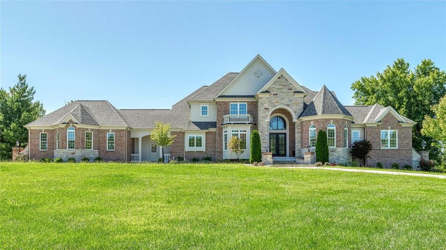 Exquisite 1.5-sty Estate home from Bruning Homes! Over 7500 sf of living space enhanced by soaring ceilings, elaborate millwork, palladian windows & wide plank oak flooring. 2-Sty marble foyer highlighted by dramatic curved staircase leads to private study, elegant dining room & great room with marble fireplace & 2-sty wall of windows. State-of-the-art kitchen with 42” white cabinetry, granite countertops, commercial grade appliances & butler’s pantry adjoins breakfast room with beamed cathedral ceiling, hearth room with stone fireplace & built-in bookcase & vaulted gathering bar.  Coffered master bed suite with marble bath with jetted tub & shower spa plus a 2nd bedroom suite complete the main floor living quarters. The 2nd floor has 3 additional bedrooms with ensuite baths. Lower Lev entertainment space features rec. room with 3rd fireplace, 2nd kitchen, workout room & guest suite, plus an elevator that services all 3 floors. Situated on 1.2-acre grounds with patio & 3-car garage. Additional Rooms: Mud Room