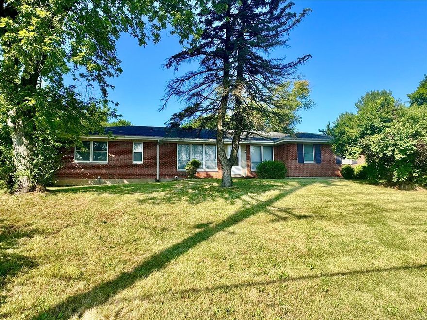 Big brick ranch on nearly half an acre with three main floor bedrooms and two full baths.  Attached 2 car garage.  Full basement with a half bath.  Big family room, sun room which opens to your private yard. 200 amp breaker box - Lennox furnace.  Schedule showings through showing assist.  Acquired through foreclosure - Sold As-Is - Please write offers on Special Sales contract - Must close at Elite Title. Additional Rooms: Sun Room