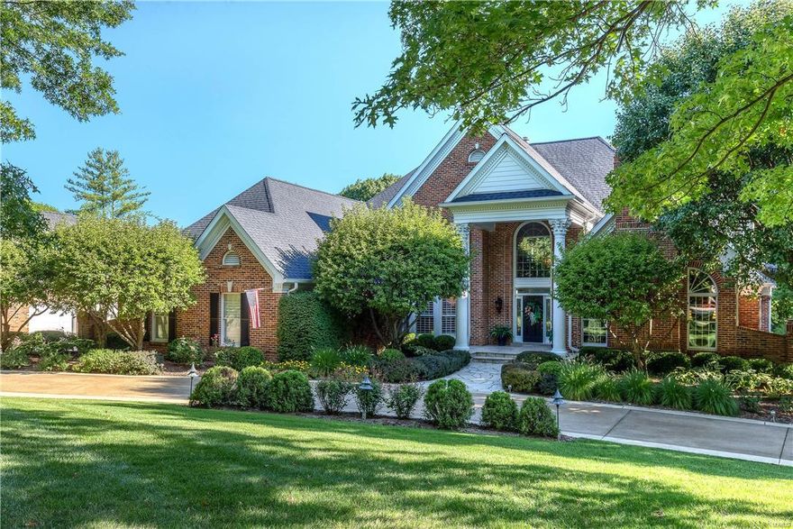 Beautifully designed 1.5-sty Estate home on 3.3 ac grounds! Grand 2-sty foyer with dramatic sweeping staircase leads to handsome library with built-in bookcases & floor-to-ceiling brick fireplace, elegant dining room featuring Julie Keefe hand-painted walls & spectacular 2-sty great room with 3 walls of windows, marble fireplace & wet bar. State-of-the-art kitchen with granite countertops, maple cabinetry, 12’ x 7’ center island & convenient planning center adjoins octagonal breakfast room with bay window & expansive hearth room with wet bar, stone fireplace & custom wall units. Coffered master bedroom suite with lavish bath with whirlpool tub offers an appealing retreat. Front & rear staircases access 3 additional bedrooms, 1 with ensuite bath & 2 with Jack n’ Jill bath. Walk-out Lower Level includes recreation room with brick fireplace, billiard room, 2nd kitchen, office & 2 full baths. Impeccably landscaped lot with 2 patios, deck with fireplace & heated pool plus 4 & 3-car garages.