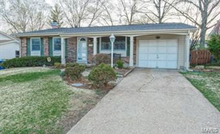 You are going to love the curb appeal, you are going to love the inside, and you are going to love the backyard setting!  Come check out this beautiful 3 Bedroom, 1.5 bath home.  There is a nice deck which overlooks the backyard the deck measures 20x16.
Updated kitchen with Medium oak cabinets plus a center island.  Double ovens with cooktop and dishwasher in 2011. The roof is new in 2012.  The hall bath has been updated.  Wood floors in the living room and all 3 bedrooms.  The vinyl siding is 6 years old.  The Lower Level has a beautiful fireplace.  White 6 panel doors and an updated 200 AMP electric box.  AAA Pattonville Schools, Pride of Ownership, conveniently located between Maryland Heights Rex Plex and Community Pool and 2,000 Acre Creve Coeur Park and Lake.