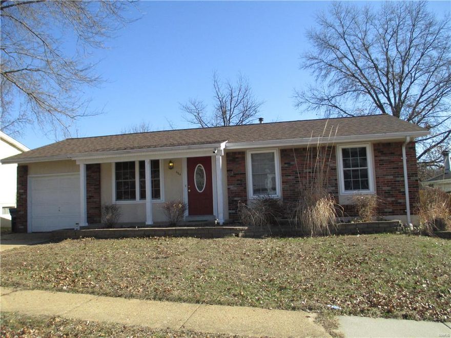 Beautifully updated 3 bedroom ranch home within walking distance to AAA-rated Bowles Elementary School (Rockwood School District) Nicely updated kitchen with black appliances, ceramic tile floors, maple cabinetry and new counter tops with an adjoining breakfast area. Additional features include hardwood oak strip floors and newer vinyl windows throughout and a 1 car attached garage! The walk-out lower level offers additional living space with a huge rec room featuring a wood burning fireplace ideal for a family/rec room, media room, or home office. Enjoy the wonderful covered patio overlooking the large fenced yard. This home is move in ready!