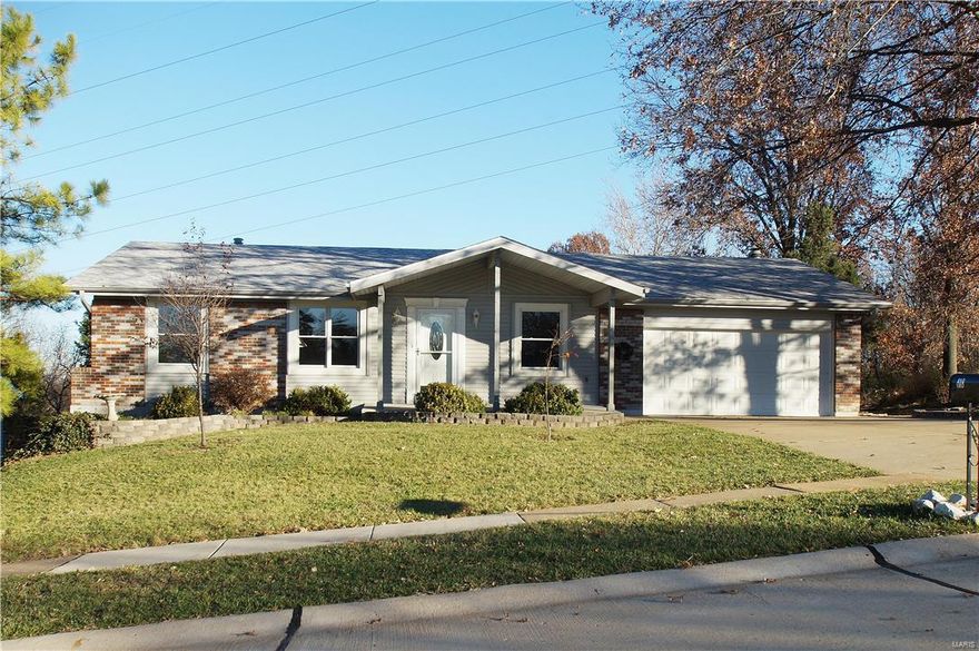 Wow - This one is a MUST see!  This large ranch style home is move -in ready.  Home features 3 bedrooms (with NEW carpet) and 2 1/2 baths.  The Main floor laundry is a plus.  The large kitchen has a center island, New refrigerator and dishwasher and is connected to the breakfast room with W/B Fireplace and leads to the large deck overlooking the partially fenced yard. There is a New roof (2015) and home has been freshly painted.  Living and Dining room both have hardwood floors.   The lower level is partially finished and has so many possible uses.  It is also a walk-out and has a half bath.  2 car attached garage and a Home warranty is being provided to buyer. Great location & Neighborhood!  Put this one on your MUST SEE List!