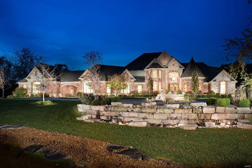 Sophistication & elegance abound in this designer perfect home on 3.78 acres. Offering the security of an intimate gated community, this 4 bedroom, 4 full & 2-half bathroom home is marked by exquisite finishing details & upgrades that distinguish this trophy home from all others. Sun flooded residence has grand scale floor to ceiling windows with dramatic vista from the time you walk in the front door. Cooks kitchen offers custom cabinetry, granite tops, side by side refrigerator, double ovens, gas cooktop w/pot filler, built in microwave & warming drawer. Handsome library boasts wall of custom cabinets, turret ceiling & stated elegance. Fabulous master suite w/reading room, private screened in porch, travertine flooring in bath w/large walk in shower, separate jetted tub, his & her designer closets. Lower level finished w/full bar, theater, game & entertaining areas. Poolside outdoor kitchen, hot tub & firepit add to the uncompromising luxury of this quintessential retreat style home. Additional Rooms: Sun Room COOL: 14 SEER+