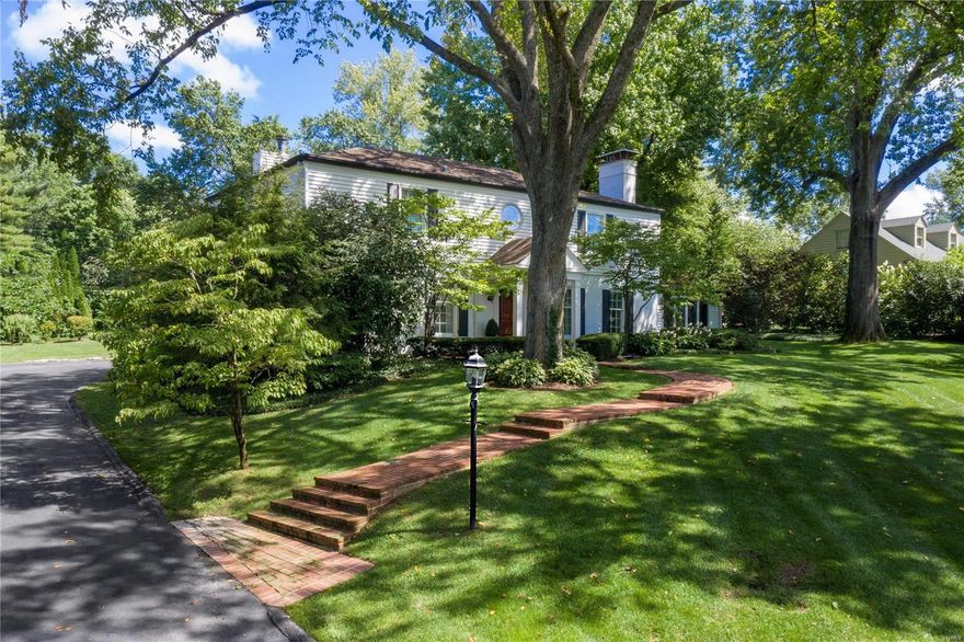 Sheer perfection!  Classic elegance & lush landscaping offer superior street presence on this quiet tree-lined lane in the heart of Ladue close to restaurants & shops.  The gracious, updated 2 story home provides exceptional livability for today’s busy family with 5 bedrooms & 3.5  baths including private guest suite or office.  Large, comfortable rooms with hardwood floors & crown molding are filled with natural light & overlook the beautifully landscaped private backyard.  The expansive  sunroom with floor-to-ceiling windows walks out to a large brick terrace.  Kitchen has white, custom cabinetry, granite counters, stainless steel appliances & opens to large family room which features built-ins & gas fireplace.  The spacious master suite has a luxurious private bath with double vanities, air tub, separate shower, chandelier & lots of Carrera marble!  Also: attached heated and oversized 2-car garage; finished lower level with large rec room with fireplace. Open Sunday 10/4 from 1-3 Additional Rooms: Sun Room