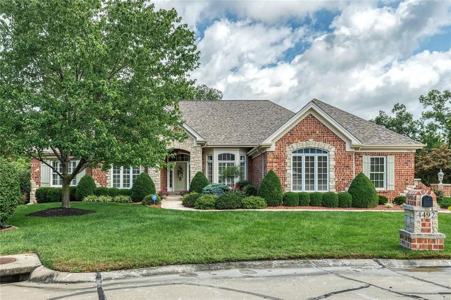 Oak hardwoods, 11' ceilings, detailed trim work & an integrated sound system add to the appeal of this Cross-built brick & stone ranch home. Impressive hardwood foyer highlighted by architectural columns leads to study with built-in work center, formal dining room with wide bay window and striking great room with cast stone fireplace & bank of windows with private wooded views. Designer kitchen with 42” cherry cabinetry, granite countertops, butler’s pantry & planning center adjoins light-filled breakfast room with adjacent screened porch & hearth room with entertainment center & stone fireplace. Coffered master bedroom suite with luxury bath with jetted tub plus a 2nd ensuite bedroom complete the main floor living quarters. Lower Level includes recreation room with fireplace, game room with wet bar, 2 additional bedrooms, guest suite & full bath. Atrium door opens to outdoor living area with deck, paver patio, fire pit, saltwater pool & hot tub surrounded by landscaped gardens.