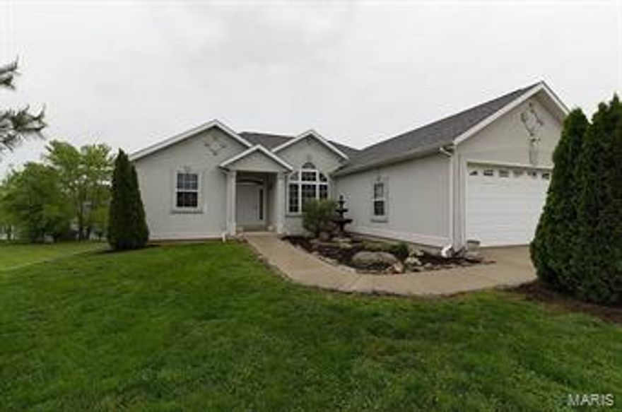 Experience this amazing home up close and personal. This one absolutely has it all!  From the initial curb appeal featuring beautiful landscaping surrounding a lovely home to the initial WOW upon entering inside to see the soaring ceilings and hardwood flooring.  This home has over 3000 square feet of living space with tons of extras including a 21x19 storm shelter along with a nice size John Deer room. The ranch design features a nice size living room with fireplace, open dining area, ample counter space and cabinetry along with a breakfast nook, laundry with tons of shelving, 4 bedrooms, 3 full baths, hobby/game room, HUGE family room all of which is providing plenty of space and privacy for your family or guests.  Some amenities:  Lake front with private access-fishermen will love stocked lake-house prewired for home security system-high efficiency HVAC unit means low cost utilities-high R Value insulation installed-new roof 1.5 years old.