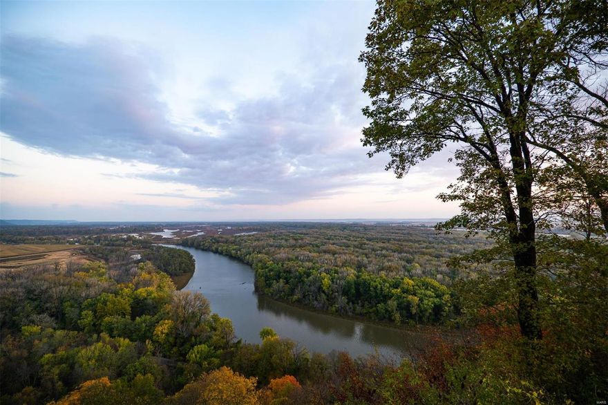 Beautiful hunting property w/ incredible views & close to STL! 260± acres N. of Louisiana offers year-round hunting w/ variety of topography & features. Eastern half of the property is the backside of a bluff that creates bend in the Salt River. The hill is covered w/ thick timber & game trails. ATV trails have been cut. At the bottom of the hill are some openings w/ food plots & deer blinds. Western half of property is flat flood-plain bottom ground that touches the Salt River & is perfect for duck hunting. Top of bluff is a beautiful log cabin w/ some of the most beautiful views seen in Missouri. The 2 bed/3 bath cabin can comfortably sleep 6 people in current configuration & has all the modern amenities needed. Downstairs Partially finished basement for storage/mudroom/wader room/extra sleeping area. Metal shed on property w/ electricity for storing your gear/ATVs. Caretaker's home on property was recently renovated.