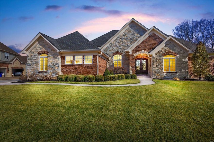 Too many details to list! Over 5300 sqft of living in this executive style stone & brick walkout ranch home in an upscale enclave of Dardenne Prairie. Side entry 3 car w/4 ft ext garage, stamped concr walkways & porch lead to the iron entry doors. Inside you'll find soaring ceilings, maple hardwd floors, tray ceilings, custom millwork, see thru dual fireplace, a master chef's kitchen w/JennAire appliances & granite counters. A split floorplan means 2 bedrms w/shared bath on one side of the home, an inlaws quarters with private entry & full bath on one end, and the owners suite tucked in the quiet back of the home with a spa like bath and amazing walk in closet. The custom office/den could serve as bedrm 6. A main floor laundry, timeless dining rm, brkfst rm, pwdr rm, & functional mud rm w/builtins completes the main level. Downstairs to a wet bar, rec area, 5th bed/5th bath, & more! Exterior offers covered deck w/fireplace, patio, sprinklers, waterview.. you just have to see this one! Additional Rooms: Mud Room