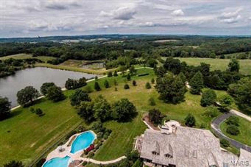 Breathtaking 175 acre gated estate, AKA Longview Estate, in the heart of Missouri's wine country, just south of Hermann, offers unparalleled level of privacy & amenities in serene & exciting retreat atmosphere, Wisely designed & quality crafted in collaboration w/Architect Ralph Fournier using natural materials, this 6,000 sq ft home has spectacular views. The ambiance & exquisite features offers high-end conveniences & flow for superb entertaining or tranquility. Apartment over 3 car garage. The grounds, a true haven for the outdoorsman or family get togethers, include:2 spectacular in-ground pools, 3 large stocked & boat accessible lakes, Koi Pond, Japanese Garden, 4 acre dog run with kennels, Aviary,Pottery shed, Vegetable Garden, 5 Deer Stands & Horseback trails. Working Farm has 3,000 sq ft caretakers home, 2,500 sq ft, Machine shop, Hay Barn, Granary, Storage barn, 4-stall stable & pastures. See special feature sheet. Add'l Tax ID 06-9.0-29-000-000-02.000 91.64 ac