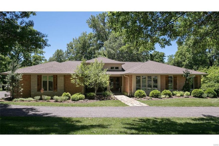 Discover a private oasis nestled on 2-acre impressive park-like setting in Town & Country. Spectacular high-end renovation (complete top to bottom) by visionary owner & brilliant architect lets you leave the rush behind in laid-back rustic luxury. From its dramatic cathedral style tongue/groove ceiling & two-story natural stone fireplace in the great room, to the well-equipped gourmet kitchen w/custom ash cabinetry & huge center island perfect for congregating, you’ll be sold before you even see the rest of the house. Gracious master suite w/sitting room & 3 beds on the main. Finished walk-out includes FR, 2 more beds, an office & full bath. And while the interiors certainly beckon you to put your feet up, you can’t possibly ignore the property. Revel in the natural and lush surroundings created by an extremely talented landscaper, dine alfresco on the huge deck or gather around the outdoor patio and fire pit and gaze into the open sky. See complete list of amenities attached. COOL: 14 SEER+