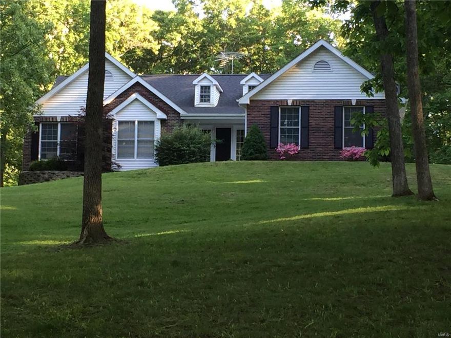 Private yet close to major attractions. This ranch home with  3 bed, 2.5 bath is nestled on 4.1 wooded acres. Huge greatroom with vaulted ceiling, floor to ceiling gas fireplace, accent can lights  makes family gatherings easy. Open floor plan with access to separate dining room, kitchen & breakfast area is convenient.  Gorgeous kitchen has cherry wood cabinets with lighting, crownmold, backsplash, functional breakfast bar Island. Vaulted Master bedrm suite with walk-In closet, massive titled shower, raised height  double bowl square vanity and separate soaking tub. Off the Master bedrm is 22x18 cedar deck to relax after a hard days work. The lower level  with half bath, bar and entertainment center area is perfect for family functions. Still plenty of storage and room to grow in basement. The oversized garage with workshop area is a plus. Owner just installed new carpeting throughout main level.  With over 2,800 square feet of living space the possibilities are endless.  A must see!!