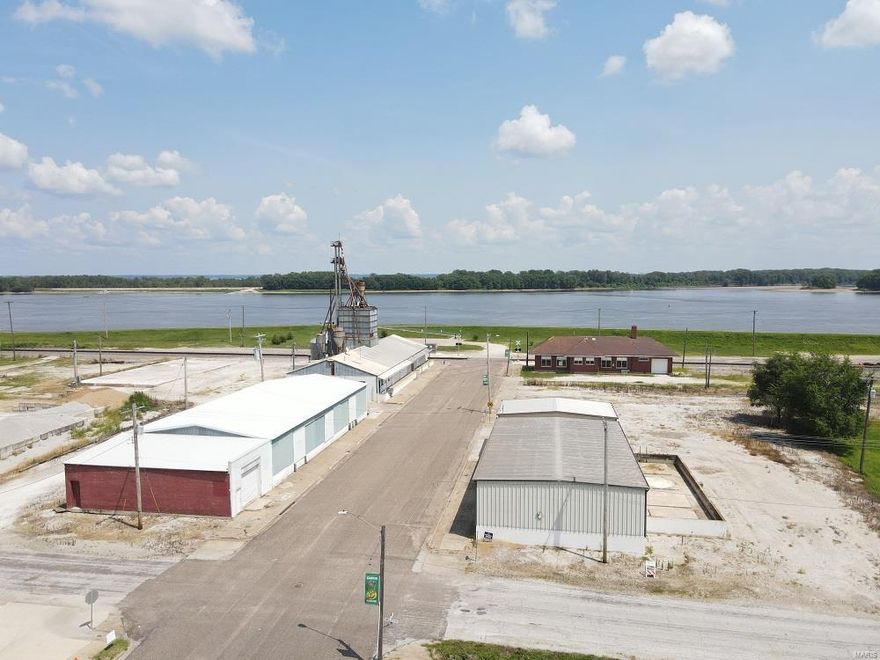 Prime commercial opportunity!  This 1.62 ac tract offers warehouse & retail space & has been home to Canton MFA for many years: 

Building #1 – This 6902 sq ft building is the current storefront, warehouse, fully operational scales, and old feed mill equipment and storage, cement floor with cement  block walls and loading docks.

Building #3 – There is a brick sided shop on the west side of this building (1,300 sq ft) with 5,200 sq ft of warehouse space, metal building & roof recently new, cement flooring with several loading dock areas.  Excellent warehouse facility.

Building #4 - This has 1,040 sq ft garage bay with clean-out pit, 2,800 sq. ft. of warehouse space with heated room (electric) for temperature-controlled products. Metal siding and roof with cement floor and loading dock area. Location: City, Downtown, Industrial Area