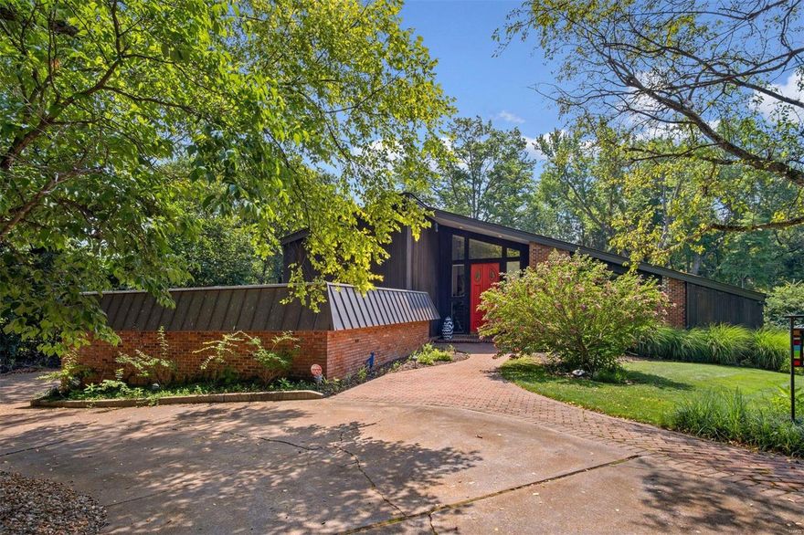 Nestled among mature landscaping, this sophisticated home is loaded w/special features. LR w/20 ft ceilings & wall of windows w/2 sets of sliders opens to a huge deck boasting Trex decking, outdoor TV, 2 commercial fans & a hot tub. Totally renovated in 2018, the sleek kitchen highlights incl. SS bkfst bar & integrated sink w/ touchless faucet, under-cabinet lighting, Brazilian Azul Macaubas quartzite & mother of pearl backsplash, high end SS appliances; & wet bar. Slider provides access to side patio w/raised planter boxes. Main floor primary suite w/wall of windows & 2 sliders opening to the back deck. Luxurious ensuite w/soaking tub, oversized shower, double vanity, & huge walk-in closet. Cozy FR, large DR adjacent to kitchen, spacious walk-in pantry,  laundry room, add’l BR & full BA round out main floor. Finished LL is entertainer’s dream w/wine storage, new carpet & flooring, updated wet bar, & 1/2 BA. Upstairs are 3 add’l BR & 2 BA, located off a “catwalk” overlooking the LR.