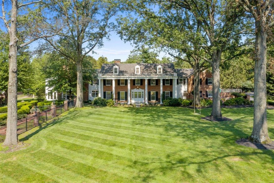 This impressive newly-renovated home sits on nearly 2 acres of park-like grounds in prime Ladue. Timeless architectural details combine beautifully with modern updates, including distinctive millwork and doors, herringbone floors, and a spectacular floating curved staircase. The superb kitchen boasts two islands, white marble countertops and slab backsplash, state-of-the-art appliances, wet bar, breakfast room, and adjoining family room with box-beam ceiling and fireplace. Upstairs, you will find an unparalleled Primary suite complete with a sitting room, office, private gym with wet bar, walk-in closet, and ensuite bath drenched in white marble. An additional 4 bedrooms, 3 full baths (2 ensuite and 1 jack-and-jill), laundry room, and bonus room complete the 2nd floor. Finished lower level with wine cellar and theatre room, saltwater pool, formal gardens, brick pathways, multiple patios and terraces, and an outdoor fireplace and grill. Attached 3 car garage and circle driveway. Additional Rooms: Sun Room, Wine Cellar