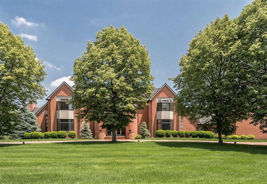 This dynamic residence with over 10,000 sq. ft. represents the epitome of stylish modern living. Designed for the present owner by noted St. Louis architect Louis Saur and built by Alper Construction, you will find impressive open spaces and incredible views. With imported materials and built-ins throughout, this 6BR/5.5+BA home offers 2sty entry, dramatic great room with bar, 16' ceilings and fireplace, large eat in kitchen/breakfast room with deck overlooking beautiful pool and 2 acre lot. Stunning main floor master adjoins sitting room w/FP, spa like his/her bath and custom closets. Four spacious bedrooms with built-in cabinetry and walk-in closets complete the 2nd floor. AN open staircase leads to a finished full walk-out LL which offers something for everyone. Starting with a family room with fireplace and bar/kitchen, billiard room, bedroom with full bath, deluxe fitness room, wine room and steam shower/sauna room. French doors open to another patio that walk out to pool.