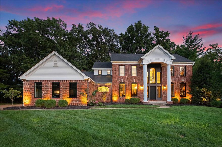 Nestled amidst nature's beauty, this luxurious 2-story brick masterpiece redefines upscale living. Step inside and be greeted by the 2 story foyer and the timeless allure of maple hardwood floors that flow seamlessly throughout the home. As you move through the house, newer Anderson black windows frame breathtaking views of lush woods. The elegant living room showcases the coffered ceiling, quartz ledger hearth and beautiful lighting. Crafted with meticulous attention, the custom kitchen boasts quartz countertops that gleam under ambient lighting. Premium Wolf appliances and a Sub-Zero refrigerator elevate the cooking experience.The primary bedroom has custom walk in closets and a spa-like ensuite bathroom, featuring a deep soaking tub, a walk in shower, and dual vanities with modern fixtures.Three more generous bedrooms finish off this level.