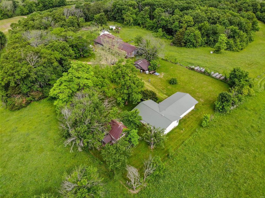 Come and Enjoy country living.  These beautiful 306 acres offer half wooded area and half pasture ands crop fields.  There is a pond for fishing and a possible lake site.  Property also has access to gravel to repair creek crossings.  Great place for hunting turkey and deer.  Boeuf creek runs through the property.  Has two historic log structures.  Substantial outbuilding. There is a home on the property that needs to be rehabbed but has a dry basement and metal roof 2014. Pergola for relaxing and enjoying the country living.  Has electric, water and septic available and hook-ups for an RV.  The wooded area is suitable for harvesting trees.  Very quiet and secluded.  Crop and Pasture has leased tenants.  Tenants must be able to harvest their crops through June of 2022 as well as Rancher who has cattle must have access until June of 2022 and new lease agreements can be made.  Seller will close 90 days from accepted contract.  Seller request U.S. Title for closing.