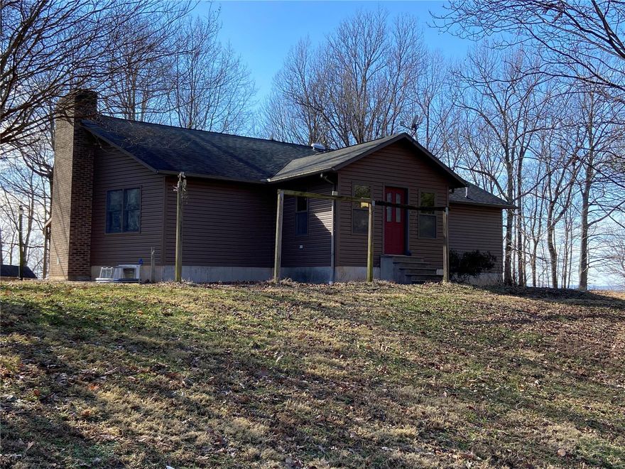 BUILT FOR A HUNTER'S HEART- Enjoy this mostly wooded 5.56+/- acres which boarders General Watkin's State Park, This home has many areas that are multi-functional with room for up to 5 bedrooms and 2.5 baths. It boasts a 29x23 Great Room w/wood burning fireplace w/insert/blowers. There's a 13x12 sun room. The large eat-in kitchen has a pantry, breakfast bar, & room for a gas oven/range in addition to the electric cook top in the island, plus an abundance of cabinet space. The main level master bedroom has his & her walk-in closets with a built-in double locking gun cabinet. The master bath is quite large w/jetted tub, separate shower, & ample cabinetry. The attached garage is an oversized 29x27 w/another laundry hook-up in addition to the main level hook up, and a separate 14x10 storage room, Outside the property has a 24x20 patio and another 21x10 covered patio. There are 2 other out-buildings plus a 48x42 shop w/half bath, wall A/C, wood stove heat. It will be gone before you know it! Additional Rooms: Sun Room