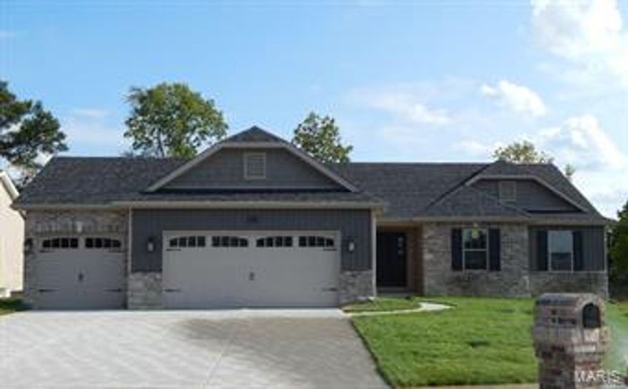 Awesome OPEN Floor Plan on a LARGE CORNER LOT.  This House offers many features such as...  Custom Cabinetry w/Quiet Close Doors & Drawers, Crown Molding, Hardware, Center Island w/Overhang; Spacious Breakfast Room; Ceramic Tile in the Kit/Brkfst, Laundry, & Bathrms; SS Appliances, Some 9' Ceilings; Tray Ceilings in Kitchen, Great Room & Over Stairwell, Coffered Ceiling in Master, Studio Vault in M Bath, All Upgraded fixtures - ORB, Luxury M. Bath w/Custom Tile Work, Grids on ALL Windows, Wrought Iron Spindled Stairwell w/Wainscoting; HARDWOOD FLOORING - GR, HALL, Foyer; Gas Fireplace w/Stone Ceiling High & Custom Mantle, Ceiling Fans in GR & M, Prewired in bedrms 2&3, HDMI Cable over F/P, Custom Paint Throughout, some Can lighting w/dimmer switches, Architectural Shingles, Siding Upgrades, Upgraded Wood Grain Garage Doors & Openers; WALKOUT w/6' Slider, 4 Windows & a 14 x 14 Patio; Sodded Front & Sides, & Brick Mailbox just to name a few.  **Photos are of a similarly built home.