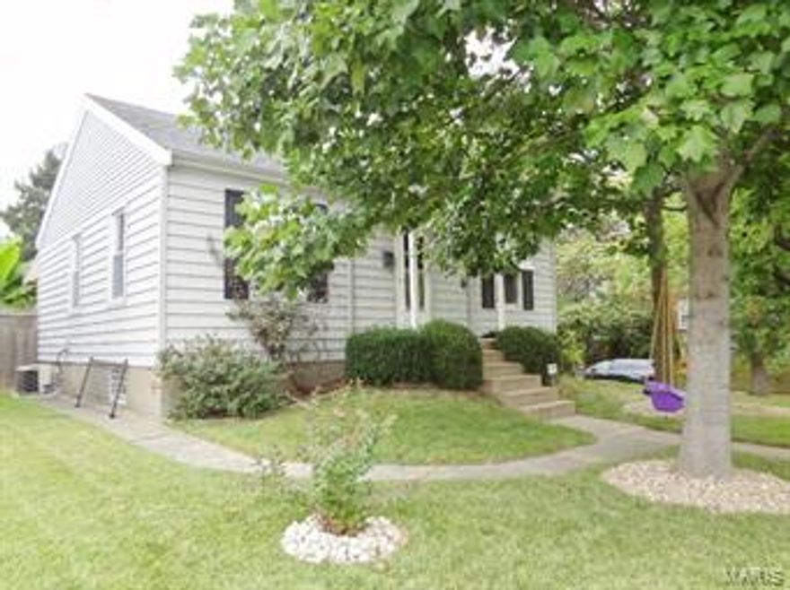 "WOW" "YOU HAVE TO SEE THIS BACK YARD" Covered patio leads out to the perfect perennial gardens and pond and even a secret garden..All fenced level back yard oasis.  This is a beautiful updated ranch home with 1159 finished sq ft.  Perfect Dogtown location next to Franz Park.  Gleaming hardwood floors and 12 inch ceramic title throughout . Remodeled kitchen with white cabinets and solid surface countertops and a beautiful title backsplash and stainless steel appliances. Enjoy the seperate Dining room/Hearth room with the handsome wood burning fireplace. In the lower level there are 2 more possible bedrooms. Seller says they will even leave the refrigerator and washer/dryer. Everything you need for your new home.