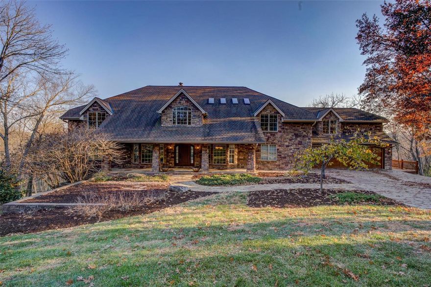 Fabulous sprawling 1.5 story nestled in a quiet cul-de-sac on 4.6+/- acres! Boasting a 4-car garage, 6 bedrooms, 6 full & 2 half baths. Enter through the gorgeous Mahogany wood front door and be amazed at the soaring vaulted ceiling, raised gas FP w/marble surround, Kempas wood flooring & abundance of natural light through the wall of windows in Living Room. Eat-in gourmet kitchen flaunts custom cabinets, granite counters, two islands, two built-in fridge/freezer's & two walk-outs. Main level owner's suite, features a large walk-in closet & lavish bath w/double sink vanity, steam shower, therapy tub, heated floors, & laundry room. Completing the main level are two office/sitting room’s, dining room, mud room, & screened-in porch. Upper level extends living quarters w/4 add'l bedrooms, large family room, bonus room, & add'l laundry room. Walk-out lower level boasts a large rec room with a raised stone floor-to-ceiling WB FP, full kitchen, movie room, bedroom, storage room, & workshop. Additional Rooms: Mud Room