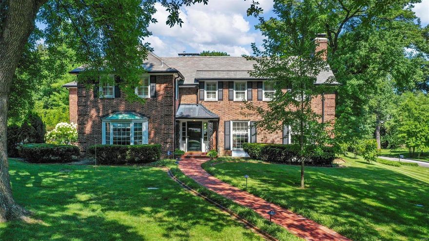 Southern charm abounds in this 1930s manse in Briarcliff.  Wonderful family neighborhood in Ladue School District! Home offers an excellent floorplan with three car garage and mudroom/laundry room. Large eat-in kitchen is a chef's delight with breakfast bar, double ovens, two dishwashers, & pantry. Formal dining room and living room with access to brick patio provides great flow for entertaining. Solarium is perfect for plant enthusiasts. Great room off the back with large wood burning fireplace, palladium windows, wet-bar and built-ins is ideal for large family gatherings. Private master suite is an oasis with its own office/den with fireplace and large walk-in closets. Four more bedrooms with jack-n-jill baths and walk in closets complete the second floor. Lower level is finished with a family/rec room, wet bar, and fireplace. Newer main roof & HVAC. Additional Rooms: Mud Room, Sun Room