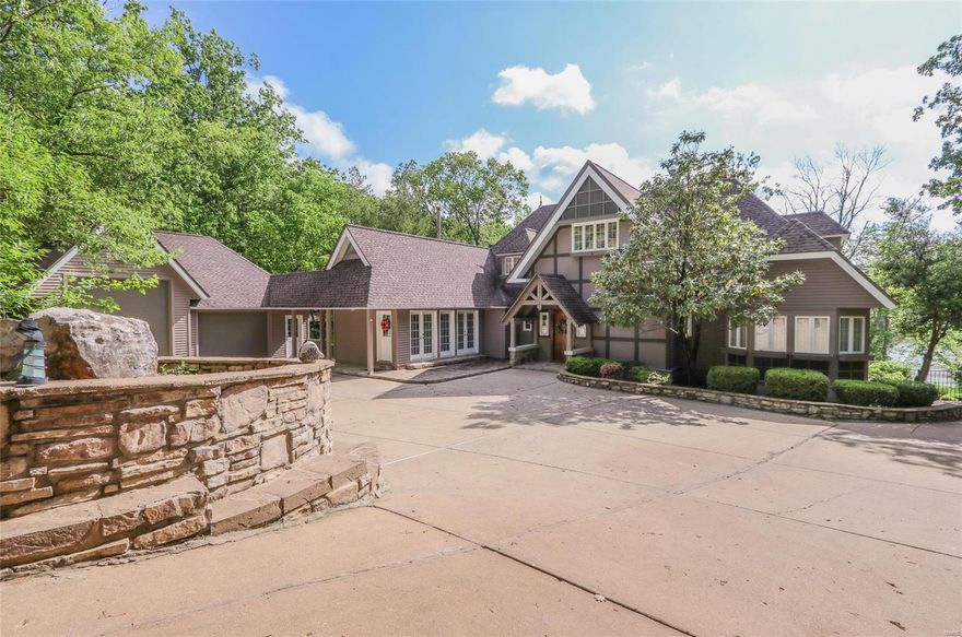 Magnificent estate offering unparalleled lake living at Innsbrook. Tremendous architectural detail and charming European flair. The focal point is the vaulted Grand Hall with hand hewn red oak timber framing, stone fireplace, and loft. The kitchen and cozy hearth room are perfect for intimate gatherings. Large groups will enjoy the massive dining room.  2 beds and bath plus loft are up, master suite on main, and 2 beds plus bath in the LL. A few highlights include 4 fireplaces, solid oak floors, MF laundry, floor to ceiling windows, ample closet space, and geothermal HVAC. Hang out in the lower level rec room, wetbar, and living room. Outside you'll love the inground salt water pool with electric retractable cover. Entertain around the pool, the many patios, gazebo, or large deck. Fish or swim off the private lakeside dock and sand beach. Oversized garage with room for a small RV or multiple cars. Incredibly private 2 acre lot in the heart of the community. Simply amazing. Must see.