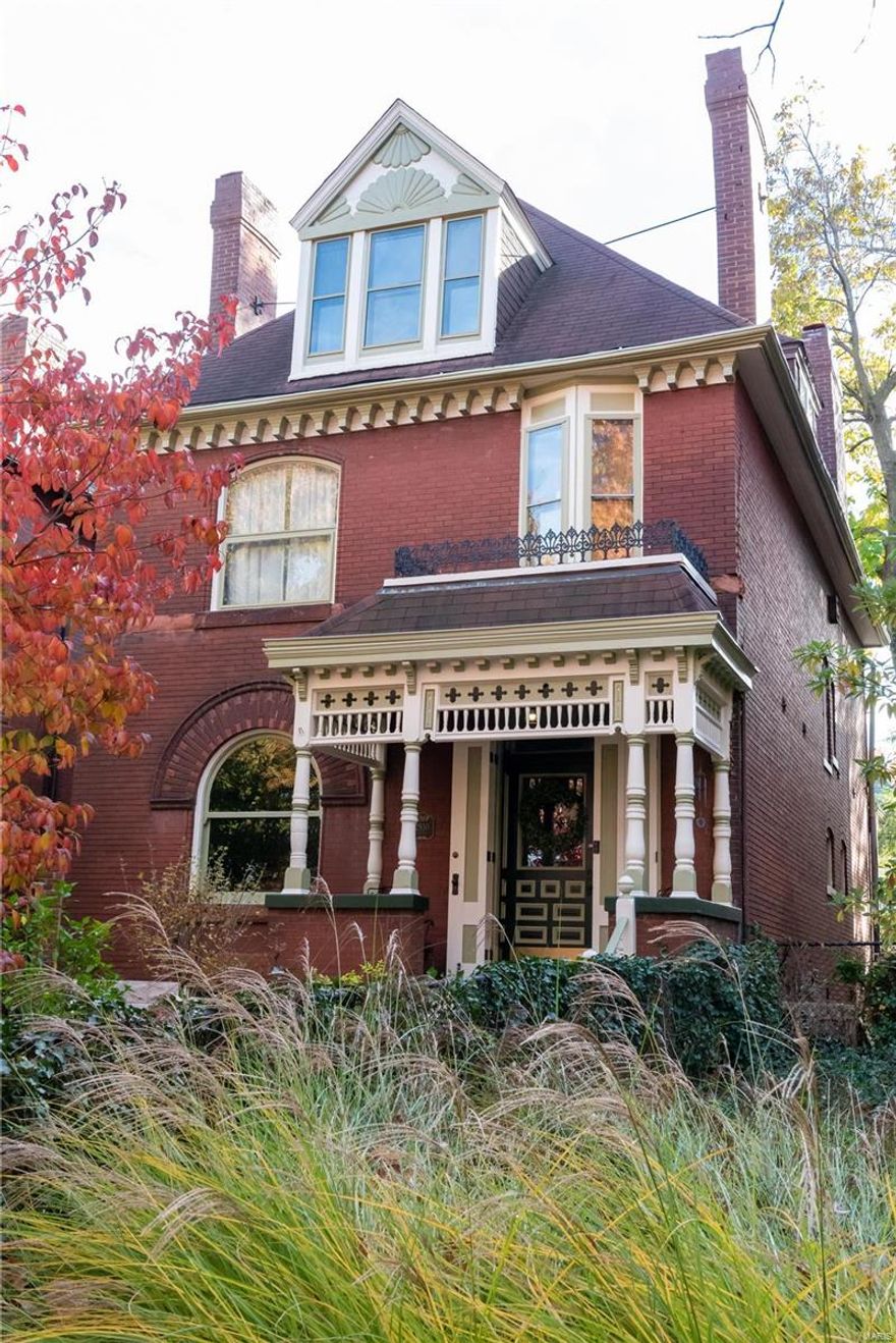 This beautiful Compton Heights home abounds with historic charm and pride of ownership! Outside, notice the lovely landscaping and freshly painted trim. Enter into the foyer and notice the beautiful fireplace, grand staircase, and round radiator! The living and dining rooms retain their historical integrity with original unpainted millwork, pocket doors, fireplaces, and minibar pantry. You'll find the half bath beyond the dining room. Walk back to the fully remodeled, well-appointed kitchen. On way up to the second floor, notice the lincrusta along the wall. On the second floor, you'll find three bedrooms, along with a library, balcony, sun room, and the newly renovated full bath. The third floor showcases two large bedrooms, another full bath, and a small room that houses the HVAC for the second and third floors. The basement features a family room and ample space for projects. Nice patio out back with oversized 1 car garage. This home has everything! Come and see today!