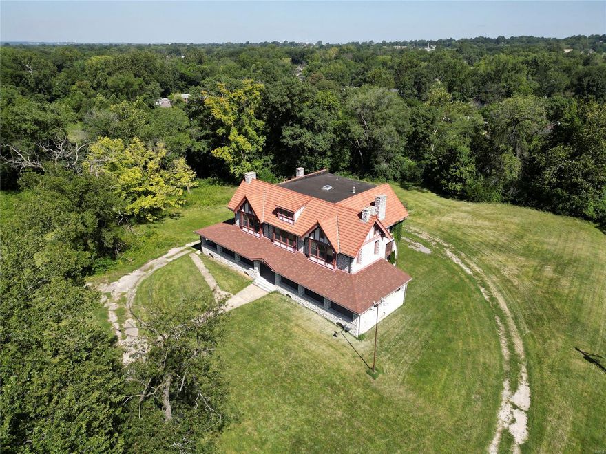 Built in 1905. Craftsmanship of this estate reflects the timeless architecture of Barnett, Haynes & Barnett. Situated on 9.85 acres this AWESOME 6966sf structure, made from hand cut MO limestone & a beautiful tile roof, Boasts a Timeless Presence! Wraparound porch has been updated, as well as the windows, 98 of them! Newer 400amp service & newer main water line. Complete list of improvements is attached. Estate backs to a creek bed, an area for pond/lake. Bring your IMAGINATION & LETS GO!! Property is currently zoned Res, but could be rezoned commercial. Had been approved thru MH for multi-use previously, see attached conditional approval. SpecialListingConditions: Possible Auction Location: Corner Location, Suburban