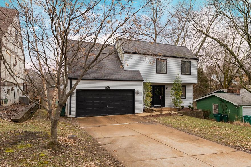 The traditional Webster floor plan you love in a 2 story home that is only 34 years old.   No worries about clearing ice and snow from your cars because this home has an attached 2 car oversized garage with direct access to the kitchen.  The main level has a nice sized living and dining room combination plus an updated kitchen with granite counters and newer appliances.  A thermal door off the kitchen leads to a large deck overlooking the private fenced yard.  A half bath is off the entry hall for guest use.  Upstairs are 3 bedrooms and a full bath plus a storage room.   The master bedroom is on the opposite side from the other 2 bedrooms.  The walk out lower level has a large family room and separate storage area.   Another sliding glass door leads from the family room to the yard.   Conveniently located in the Tuxedo Park community close to Webster University, Old Orchard, shopping, restaurants.
