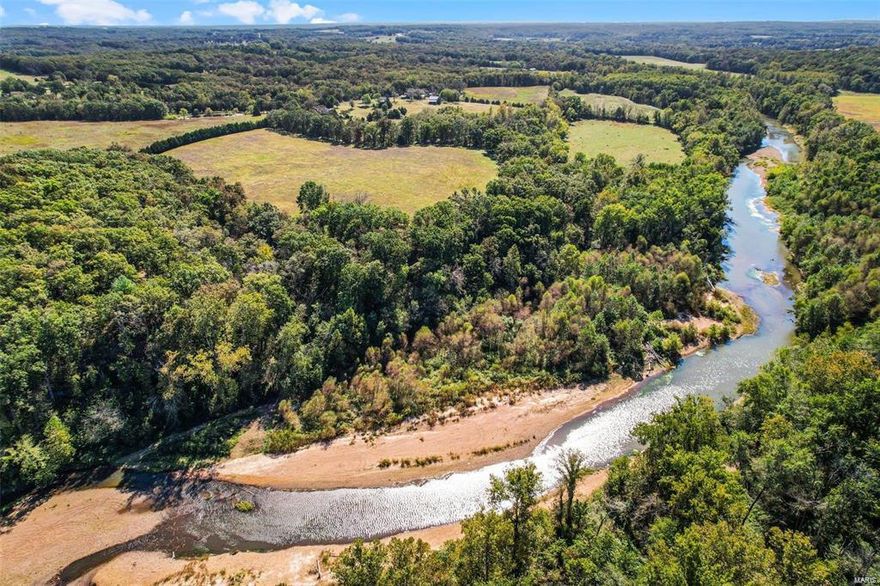 This RARE TO FIND 144-acre PROPERTY is nestled along the SCENIC BOURBEUSE RIVER represents a one-of-a-kind opportunity for buyers looking for a blend of natural beauty & comfort. 1/2 MILE RIVER FRONTAGE! The ranch home offers on the main level a kitchen w/plenty of cabinets, breakfast bar, separate dining room, living room, primary bedroom w/full bath, an add'l bedroom, & hall bath. Walk-out lower level features a family/rec room, bedroom, full bath & laundry area. 1-car attached garage & 4-car detached garage. Fabulous covered deck & patio, great for entertaining or enjoying the stunning views & sunsets. Perfect use for farming, family home, weekend getaway, or recreation. The property boasts rolling fields & woodland. Several outbuildings used for storage, agriculture purposes, workshop, etc., old log cabin, & barn w/loft. Stocked ponds & creeks enhance the appeal. Relish the River w/swimming, camping, & boat access. Duplicate Listing Original Listing MLS#24062587 New MLS#25014382
