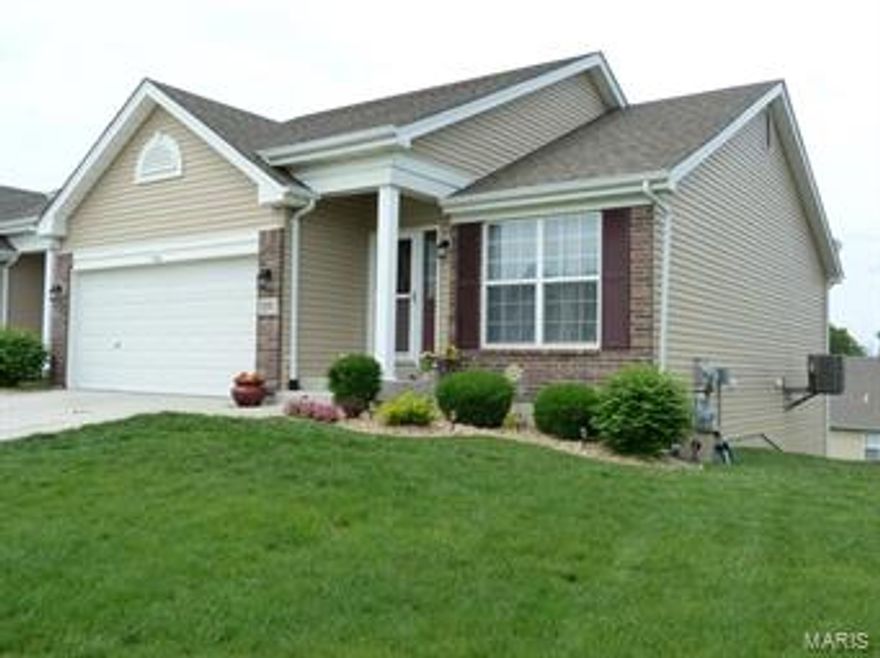 Beautiful Villa with so many upgrades:  Vaulted Ceilings; Wood floors Entry, Kitchen, Breakfast Room and Hallway; 42" Custom Maple Cabinets; Breakfast Bar; Stainless Steel Appliances; Bay Windows in Breakfast room and Bedroom; Main Floor Laundry; Spacious Bedrooms--Master with Walk-in Closet, Shower and Adult Height Vanity.  The walkout lower level is open and bright with extra window, 2nd laundry hook up, rough-in for full bath....ready for you to put your finishing touches.  All this is located close to Hwy 40, 364 and plenty of shopping.....Hurry this one won't last long!