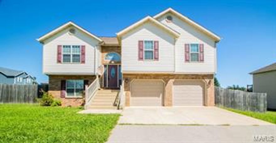 Beautiful home located in the highly desired Taylor Hills Subdivision and close to the West Gate of FLW! This home sits on a fenced corner lot and features 5 bedrooms, 3 bathrooms. Walking into the living room, you will immediately notice the gorgeous laminate wood flooring that run throughout the entire home and vaulted ceilings. Also open to the kitchen/dining area allowing for plenty of space for entertaining. The kitchen provides custom cabinetry, solid surface counter tops, stainless steel appliances and an adjoining dining room with access to the back deck. The master bedroom suite offers tray ceilings, walk-in closet and it's own private bathroom with double sinks and a beautiful custom tiled shower. The main level also provides two guest bedrooms a guest bath. Head down stairs to find 2 more generously sized bedrooms, full bath, storage providing shelving and a huge garage with plenty of room for a workshop. This home has it all! Call us today to take a look!