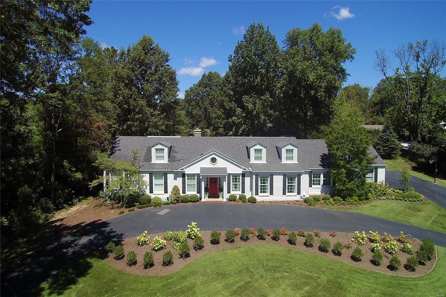 Situated on a beautifully landscaped 1-acre lot on desirable Clermont Lane, this 1.5-story home offers classic style & updated amenities. The entry foyer opens to the living & dining rms with elegant millwork & hardwood floors. Superb kitchen with KitchenAid, Dacor & Fisher Paykel appliances, plus center island & butler's pantry/wine bar. Convenient mud/laundry room has built-ins & a half bath. The hearth room has built-ins, gas fireplace and French doors to the terrace, yard & pool. Dream master suite renovation with master bedroom & sitting room, marble bath with separate vanities, a freestanding tub and luxury shower with digital Kohler system & multiple body sprays, plus 10' x 13' walk-in closet with island & organizers. The upper level has 3 bedrooms - one with en suite bath & two sharing a Jack & Jill bath, plus bonus room. Lots of natural light. Main & back staircase. Circle drive. Enjoy the heated pool with Pebble Tec surface, large terrace & professionally landscaped grounds. Additional Rooms: Mud Room