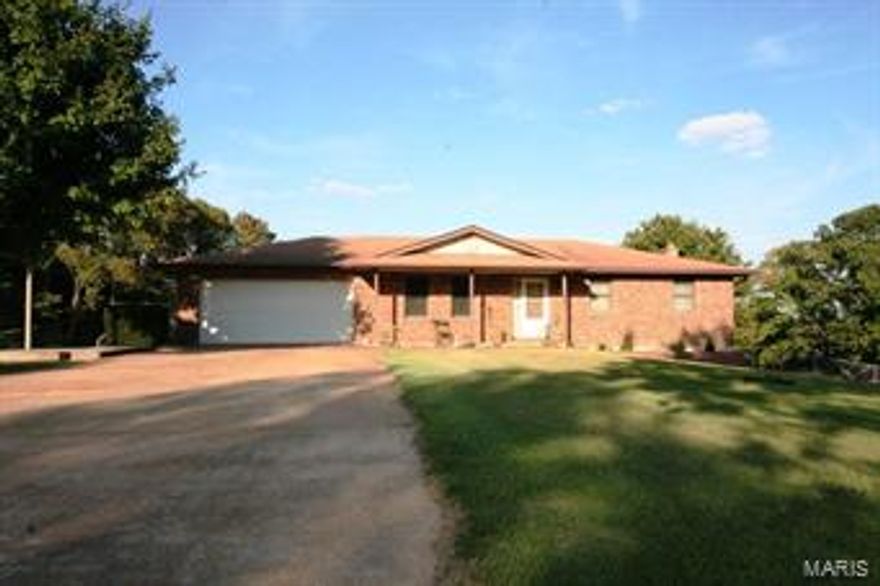 Awesome mini farm on 13+- acres with pond.  Property is fenced and cross fenced. Home is solid will full walk-out basement and offers 3 bedrooms, 2 bathrooms, & a gourmet kitchen. The nice deck off the breakfast room gives a view to die for and the patio area underneath the deck is a great shaded area to be ground level while the kiddos play in the huge fenced back yard!