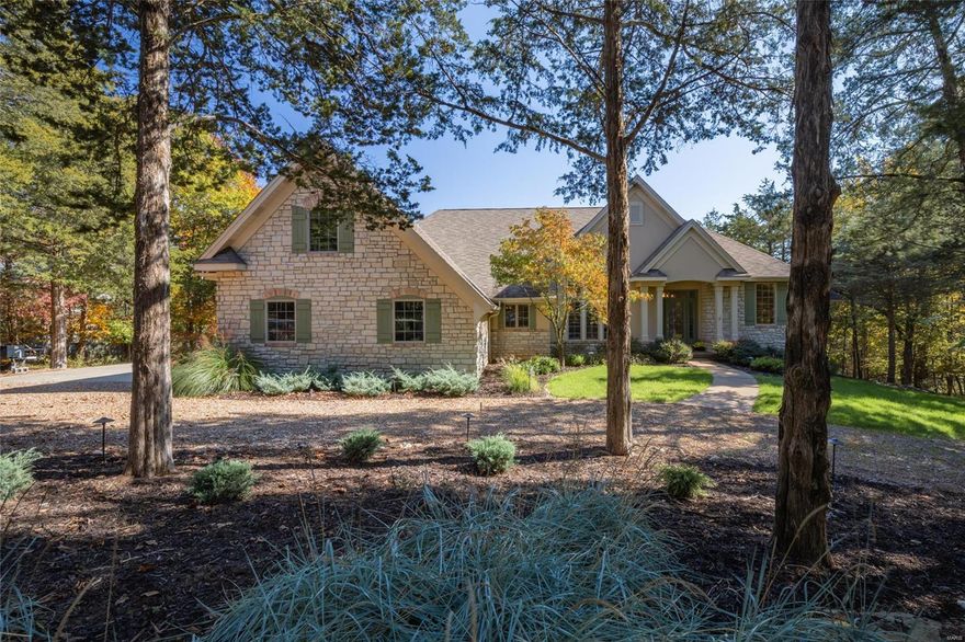 Perched on the shore of Lake Charrette, this premier lake home is ready for the whole family to spread out and enjoy the peaceful woodland vibes of Innsbrook Resort. Split into 2 gorgeous levels of finished living spaces, everyone will be able to enjoy their own piece of paradise comfortably. The main level’s open floor plan boasts a seamless living/dining combo decorated with intricate built-in shelving, hearth room w/ gas fireplace, sunroom, chef’s kitchen, and oversized windows that carry the beauty of the outdoors into every sq ft of the interior. Down the cascading staircase, the lower level offers a great space to entertain with a pool table, wet bar, rec room, gym, 2 additional bedrooms, full bath, and walk-out access to the patio. Once outdoors, enjoy ultimate relaxation on the expansive maintenance-free deck, cast a fishing line off the private dock, or enjoy a cozy fire on the gorgeous lakeside flagstone fire pit.  Come and live your best life in this lakefront dream home! Additional Rooms: Sun Room