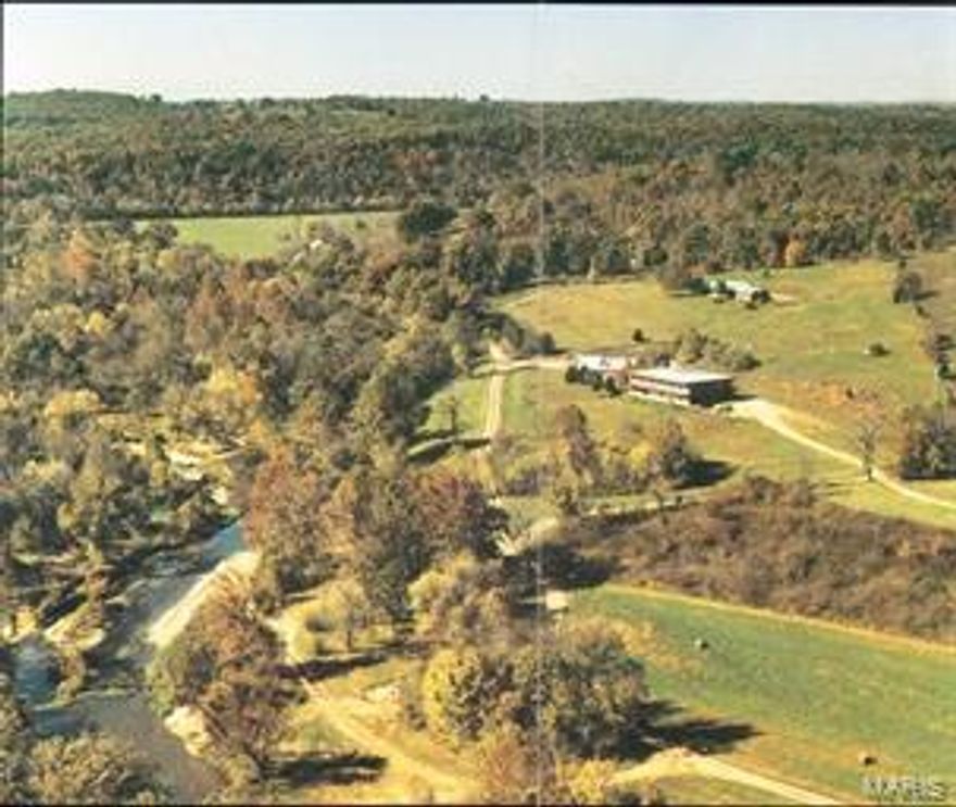 320 secluded acres on Turkey Creek fed by 5 independent Ozark Springs. The springs gushes 15,000,000 gallons a day. It's a trout stream that rushes through the ranch for 1 mile providing exciting TROUT fishing for the fisherman from the novice to the expert. The year round COLDWATER spring fed stream offers a variety of conditions from beautiful rapids to slow moving currents, sunny shallows to shaded deep pools, unique to both fly-fishing and light tackle fishing, Turkey Creek offers it all. The ranch previously was operated as a recreational Trout Fishing Park for years. It has a 22 bed lodge and an independent restaurant with commercial grade kitchen. Think that's enough, the property is well pastured for horses or cattle. There is a 2200 square foot, ranch style main house and a 1500 square foot guest house. The owner will throw in the tractors, backhoe, dump truck and other personalty pictured. This magnificent property is being offered turn-key. $OWNER WILL CONSIDER FINANCING$ Location: Rural