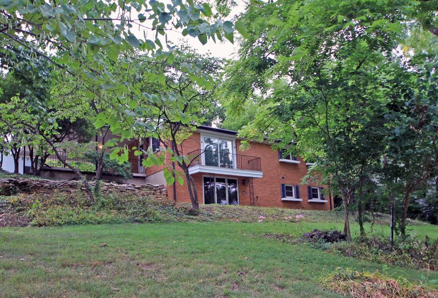 Who wouldn't want to live in this beautiful, secluded part of Kirkwood?  This move in ready mid-century modern ranch home is situated on a corner lot surrounded by trees, perennials, & ground coverings.  The open floor plan of this 3 bedroom, 2 full bath home has so much to offer.  The living room is accented with large windows to look out on the wooded property. The kitchen boasts an eat-in design.  The master bedroom is large at 16x11 and features a full bath.  The LL is enormous and perfect for a rec room.  It also has a full bath & built in wet bar.  There are 2 additional rooms that can be great storage or additional living space.  Sliding glass doors open to a patio that overlooks the peaceful surroundings.  New A/C in 2018.  With close access to Hwy 270, Dougherty Ferry, & Big Bend, this house is ready to be your home!