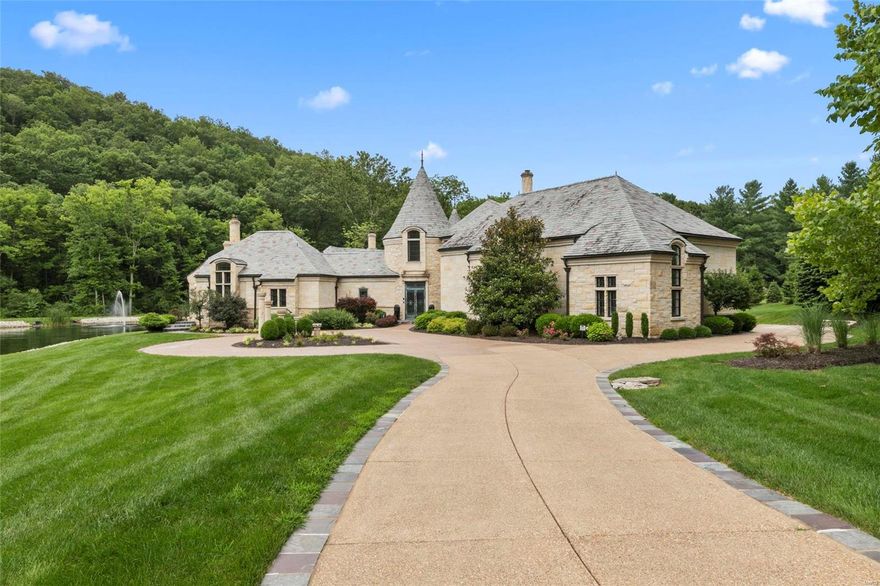 Breathtaking European Castle! 6 Bed, 9 Bath, 12,000+ sq ft of living space situated on 5.48 acres in gated community. Walk through bronze front doors & enter the 2 story foyer that leads to the great room w/fiber optic star lights and cherry hand laser cut ceiling as well as cherry & walnut dovetailed floors. Kitchen has custom cabinetry, multi level island, 2 sub zero fridges, wine fridge, 6 burner Wolf stove, 2 dishwashers, 2 sinks & walk in Butlers Pantry. Master Bedroom Suite includes triple layer custom crown molding with cherry wood ceiling & fiber optic star lights, Executive Office w/see through fireplace, His & Hers Closets, 2nd laundry room, Exercise Room, Master Bath w/His & Hers vanity, walk in shower w/LED Lighting & infinity tub. Finished LL includes 1000 bottle wine cellar, fireplace, half bath, & Bar. Theater Room w/seating for 7. Guest house has private entry w/full bath & kitchen. Stocked lake w/waterfall. Nearby St Albans featuring 2 world class 18 hole golf courses. Additional Rooms: Sun Room