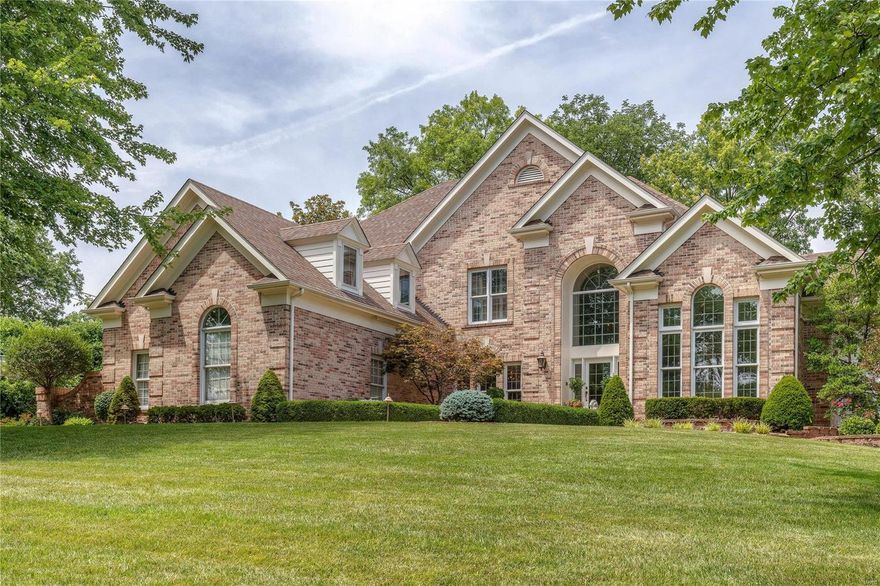 STUNNING 1.5 story home in a quiet cul-de-sac in the heart of the highly sought after Ladue school district! This home features numerous updates the most notable being the molding details & the lavish backyard retreat! The BREATHTAKING 2 story foyer sets the tone for this amazing home. The large main level master suite is a true hideaway. The living room in this home is a work of art with a wet bar, millwork detailing, large tinted windows, & beautiful fireplace. The exquisite kitchen boasts a vaulted hearth room & marble counters. The upper level offers 3 large rooms, 2 full baths, & a bonus room. The finished walkout basement is a beautiful addition with a workout area, a large entertaining space, a full bath, & a storage area. The French doors in the finished basement walkout to a backyard oasis. Feel like you are on vacation everyday with the beautiful sundeck patio, the heated saltwater pool, the waterfall with hand cut stones,& the lavish spa. This is a one of a kind dream home!