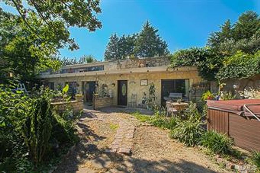 This very unique, passive solar post tension earth home has many beautiful upgrades. The open floor plan and natural lighting are great for entertaining. The kitchen has recently been remodeled with beautiful custom cabinetry and counter tops. There is a lot of garage space and a relaxing patio outside. This home sits on a little over 2 acres with a private well and septic. The master bath has a large Jacuzzi jet bath tub and a large walk-in closet. The utility bills are low and the need for air conditioning is very minimal in the summer. If you want to feel secluded but close to the Hwy. this unique home is a must see.
•••MOTIVATED SELLER•••