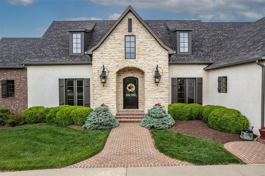 With its Southern European-inspired architecture, high-end finishes, & magnificent private in-ground pool, this exclusive estate in Lebanon, Missouri, offers a lifestyle of unparalleled luxury and indulgence, where every day feels like a vacation in paradise.
Luxury & Livability with over 6800 square feet this home has 4 plus bedrooms, 4.5 bathrooms, 4 car garage and comes w/1.60 acres M/L. The gourmet kitchen features-high end appliances, granite counter tops, custom cabinetry, and an UNBELIEVABLE walk-in pantry. The large open Oak Stairway is the focal point of the home. Formal Living room with Bar & gas log fireplace. Formal Dining with Cathedral ceiling. Master Suite w/exercise room & HUGE walk-in closet!  Upstairs has two bedroom suites w/large closets & Bonus Room that could be that 5th bedrm. Basement has large family room, fireplace, wet bar, game room, guest bedroom, full bath & huge storage/safe room. Cozy brick patio is just amazing & let’s not forest the basketball court.