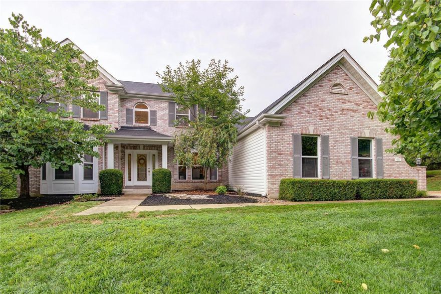 Welcome to this stunning 1.5 story on nearly an acre in Ballwin! A brick exterior, beautiful landscaping, and side-entry garage make for great curb appeal! Inside, you'll be wowed by the two-story foyer, opening to the dining room with a gorgeous chandelier, and the living room beyond, with a woodburning fireplace flanked by 2-story windows. You'll love the gleaming hardwoods, crown molding, 9' ceilings, and stylish light fixtures. The kitchen boasts white cabinets, granite counters, breakfast room, and opens to the vaulted family room. The master suite has a bay window, dual vanities, step-in shower, and corner tub. A half bath and laundry complete the space. Upstairs, the loft is perfect as a home office, plus three more bedrooms and two more full bathrooms! The walk-out LL has large windows and is ready for your finishing touches. Enjoy summer on the composite deck, overlooking woods and hills. Moments from Castlewood Park, schools, shopping, and restaurants. Don't miss out!