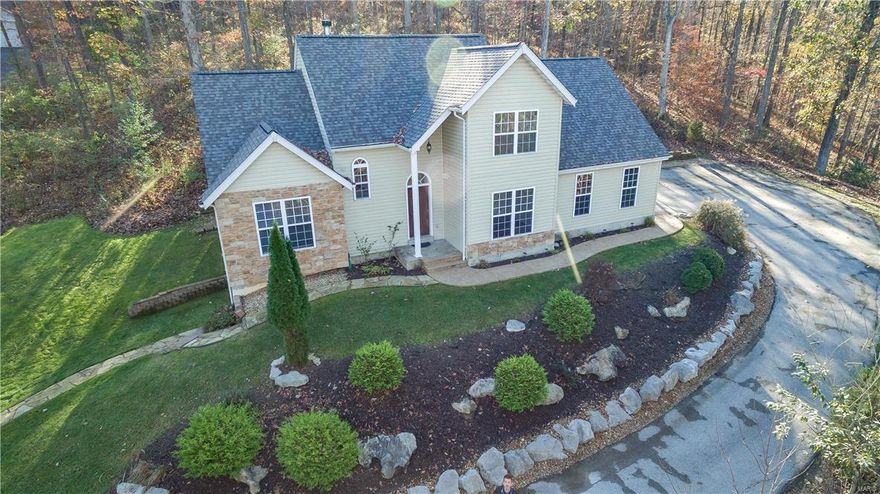 This setting is incredible.Unbelievable landscaped lot in touch with Nature. Home is nestled in a Picturesque, Private, Peaceful, Open Bright and Light describes this updated 1.5 sty in the ever-so-desirable Hawks Rest Neighborhood. Pride of Ownership shows throughout.2sty Great Room with wood flooring and wood burning fireplace flanked by wall of windows overlooking professional Landscaped wooded lot with beautiful views from all angles. Nice dining room. Cooks Kitchen w/ Electric  Cooktop, Cabinets, Granite Tops, Breakfast Area w/ designer Ceramic floors w/ access to adjacent large deck perfect for entertaining. Spacious Master Suite, Updated Bath with double sink, designer tile floors.Large Secondary bedrooms. Nicely Finished W/O LL has huge Game/Rec,Exceptional Private Wooded Lot for nature lovers & kids exploration. Phenomenal Garden Paver walk to Level Play area perfect for kids and a relaxing fire pit too. Water Filtration System. his is an awesome Private setting in great area!